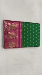 Emerald Green Lichi Silk Saree with Royal Pink Zari Border