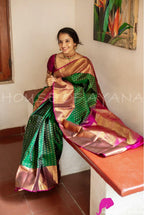 Emerald Green Lichi Silk Saree with Royal Pink Zari Border